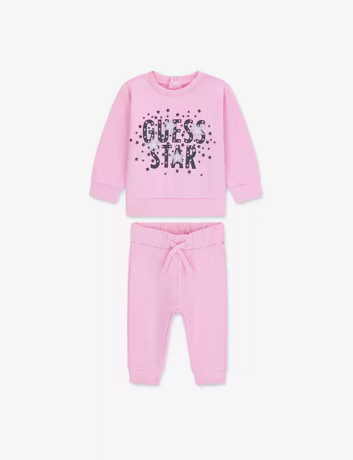GUESS ENSEMBLE 2 PIÈCES EN MOLLETON GRATTÉ ROSE AVEC LETTRAGE NOIR PAILLETÉ, PANTALON ROSE AVEC ÉLASTIQUE AUX CHEVILLES